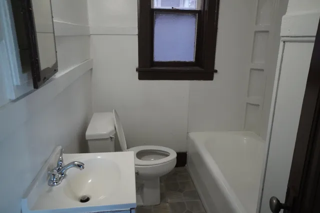 a bathroom with a toilet and a sink