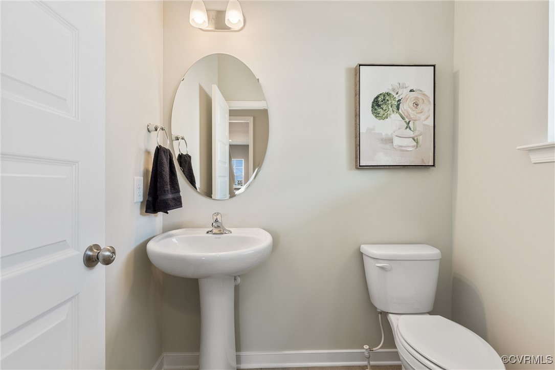 38 Central Place Aylett, VA 23009 - Photo 19 of 32 a bathroom with a toilet sink and mirror