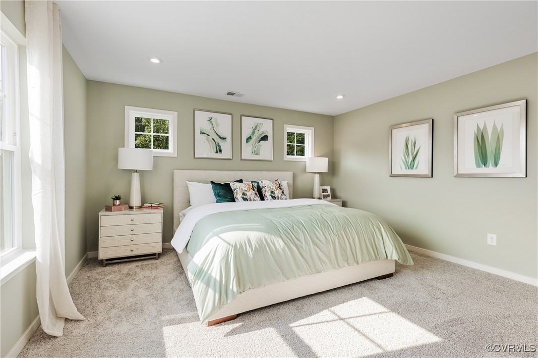 38 Central Place Aylett, VA 23009 - Photo 21 of 32 a spacious bedroom with a bed and a couch