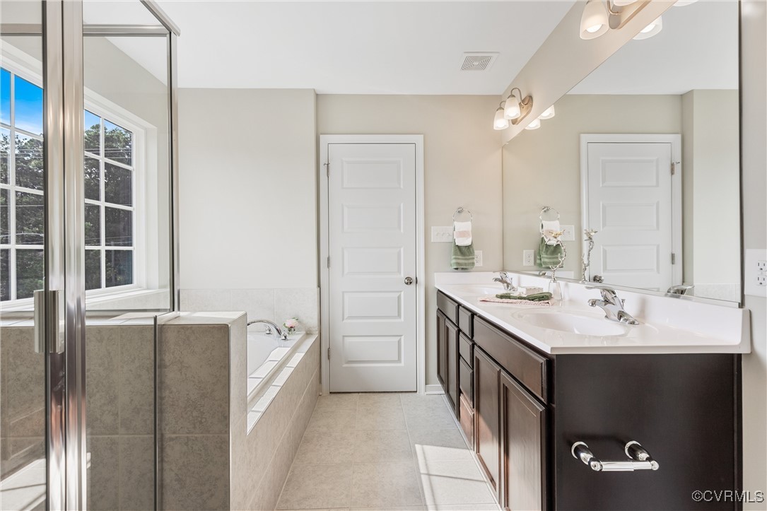 38 Central Place Aylett, VA 23009 - Photo 23 of 32 a spacious bathroom with a double vanity sink a mirror and a bathtub