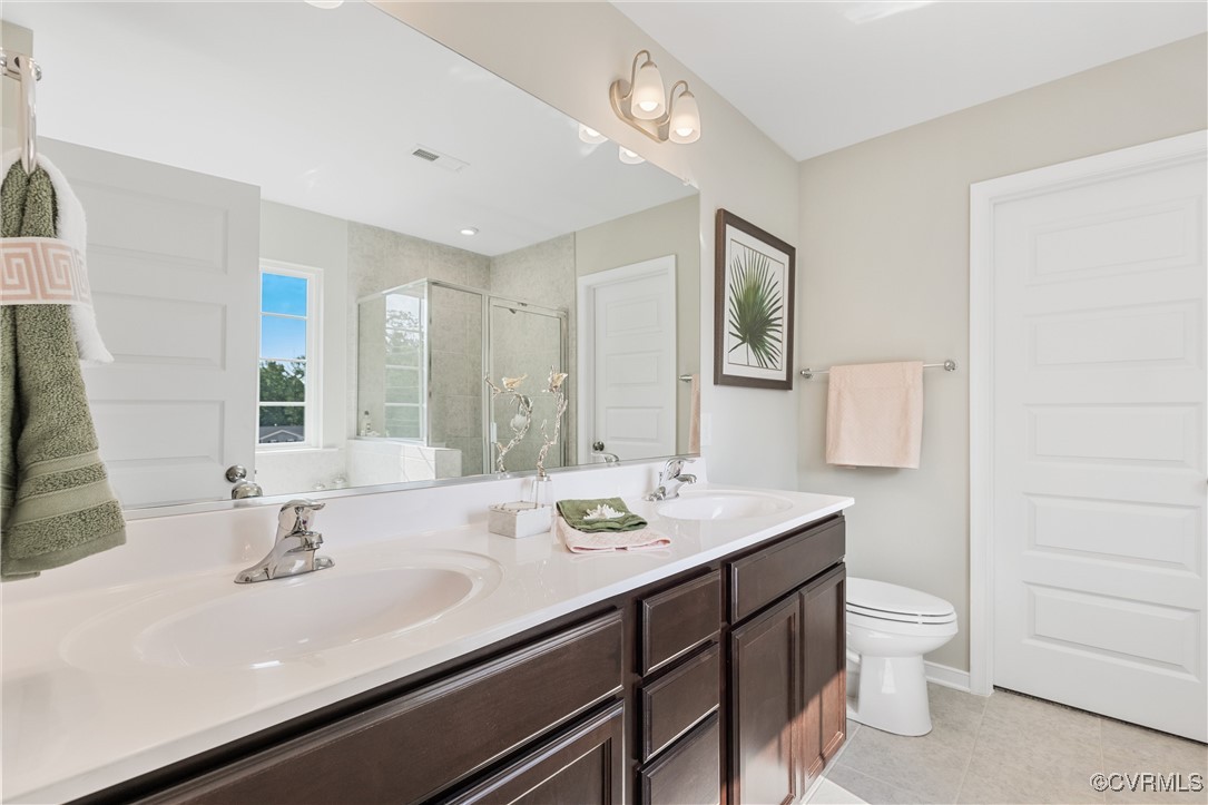 38 Central Place Aylett, VA 23009 - Photo 24 of 32 a bathroom with a sink a toilet and mirror