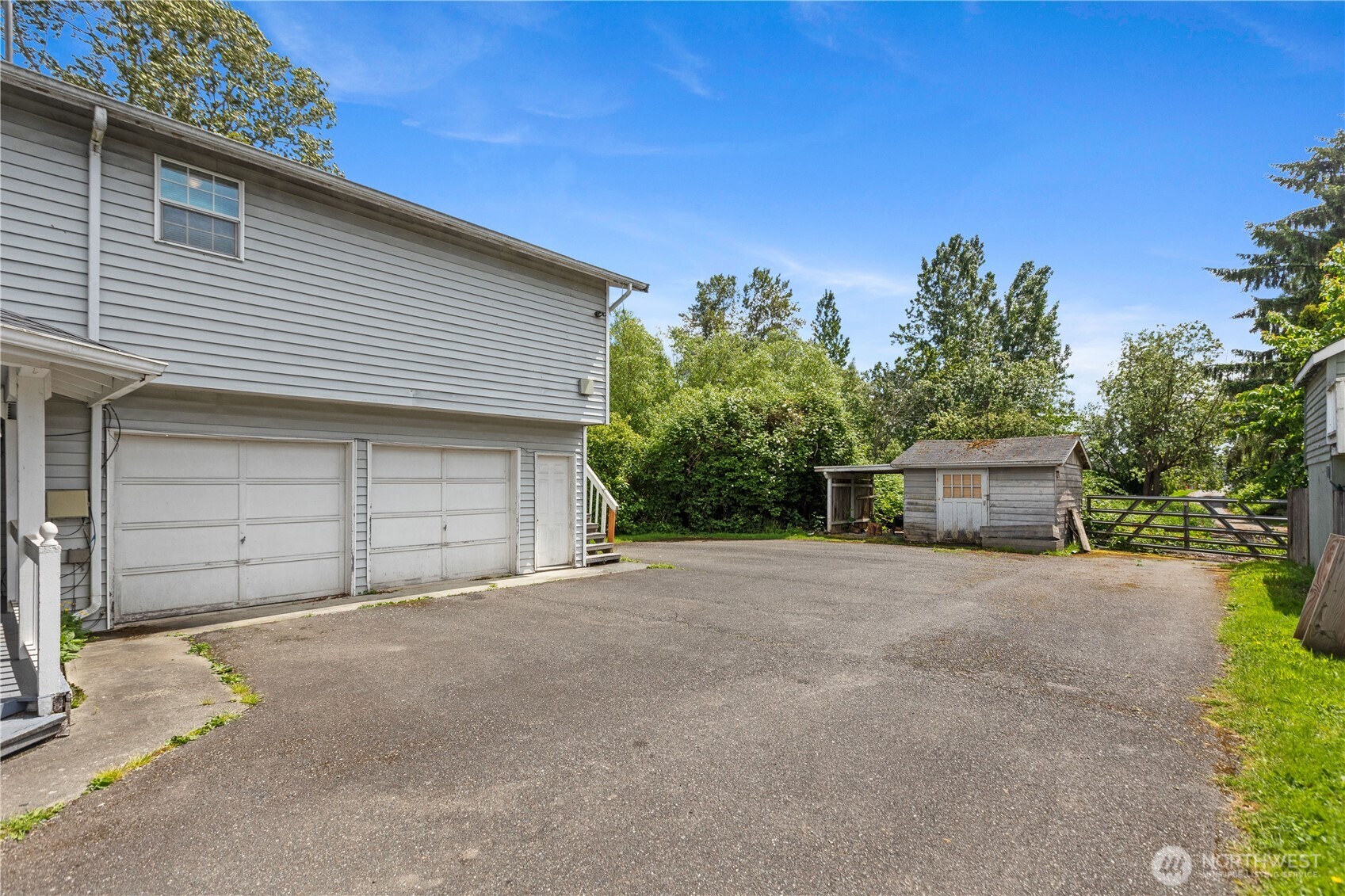 2312 Jade Avenue Everett, WA 98201 - Photo 29 of 34 a front view of a house with a yard and garage