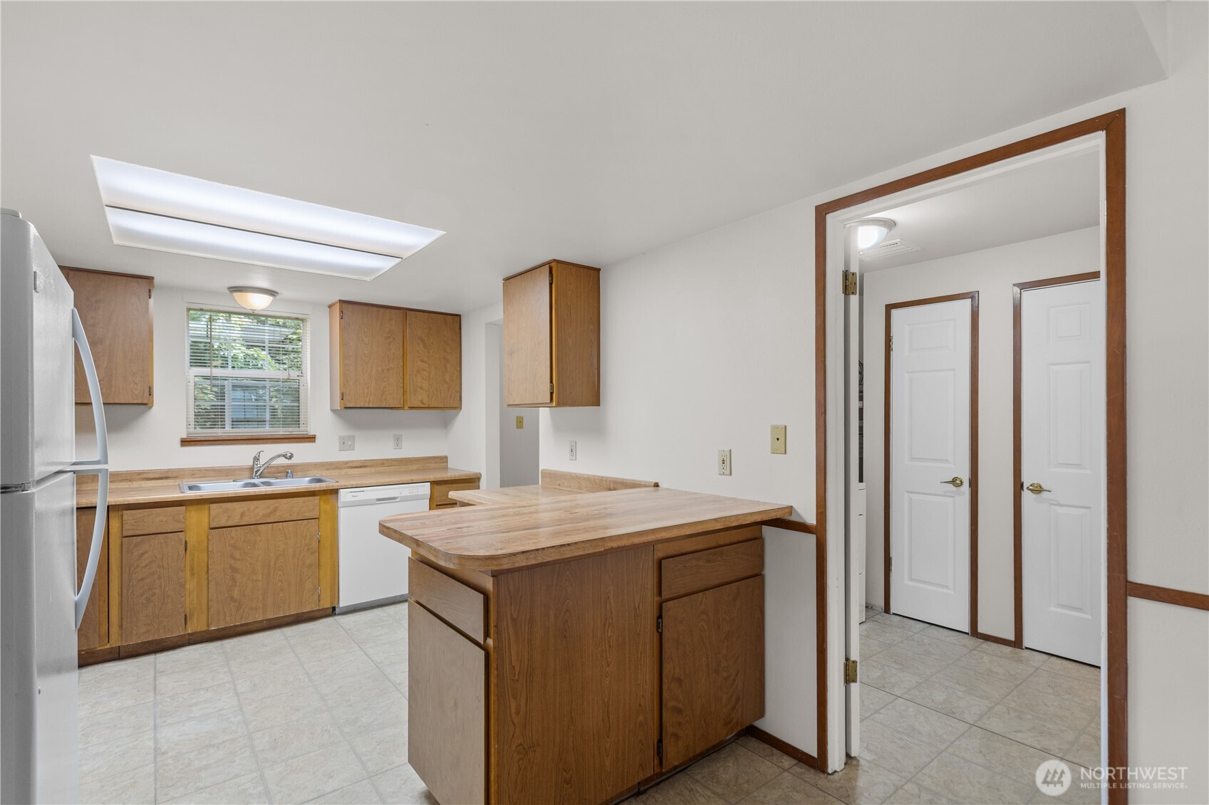 2312 Jade Avenue Everett, WA 98201 - Photo 6 of 34 a kitchen with a sink stove and cabinets
