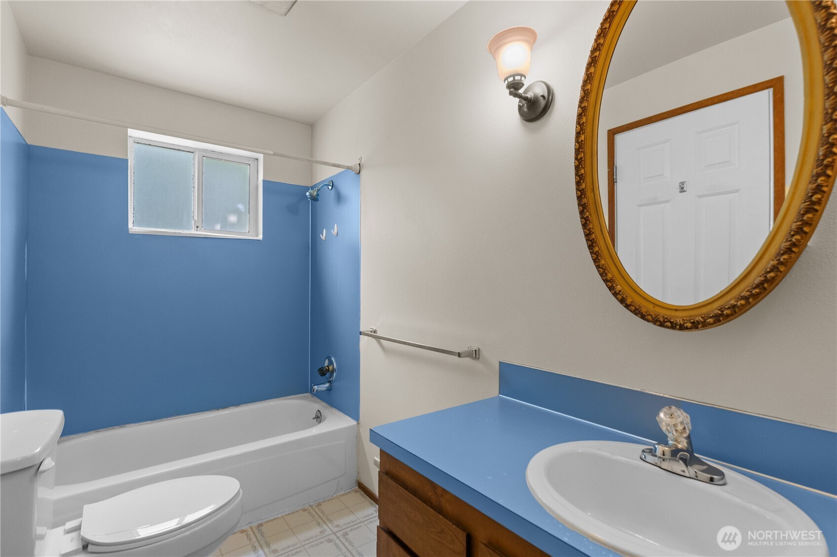 2312 Jade Avenue Everett, WA 98201 - Photo 10 of 34 a bathroom with a sink a toilet and a mirror