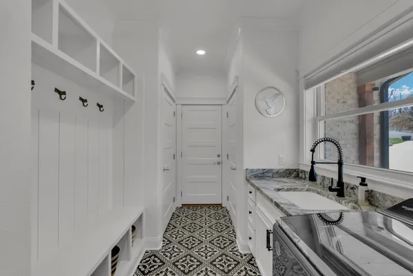 a bedroom with a bed a flat screen tv and balcony