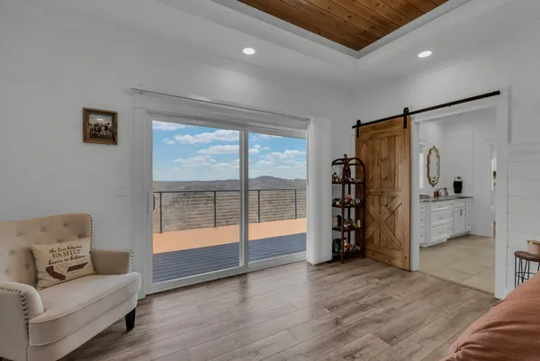 a view of a livingroom with furniture and window