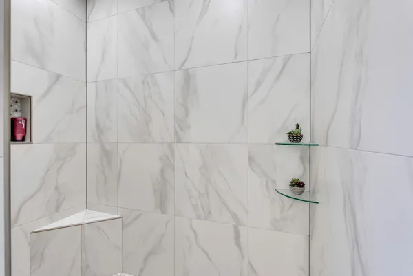 a living room with a fireplace and a fireplace