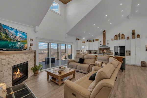 a view of a hallway to a house with wooden floor