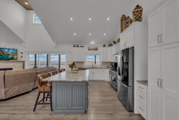 a view of a room with furniture and wooden floor
