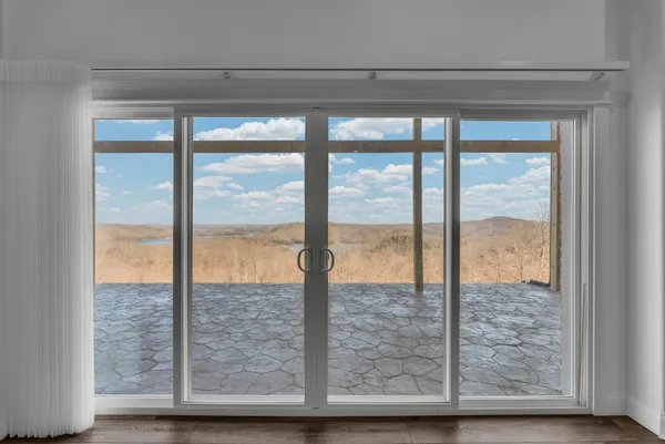 a view of a swimming pool with an outdoor seating
