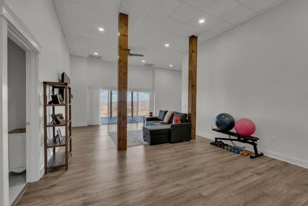 a view of a dry yard with wooden fence