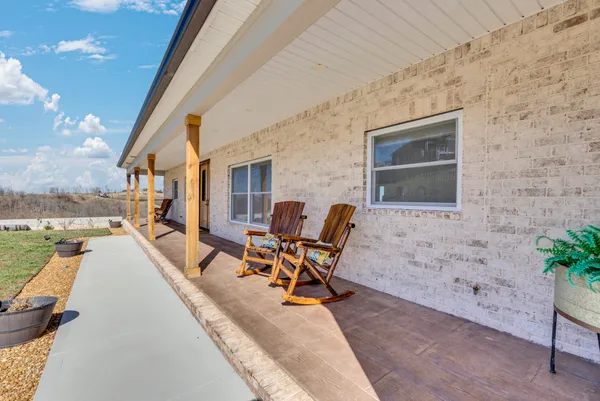 a bath tub sitting next to a white wall