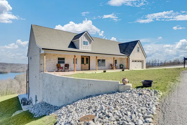 a large bathroom with a granite countertop double vanity sink and a mirror