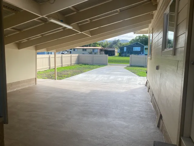 a view of a house with backyard and porch