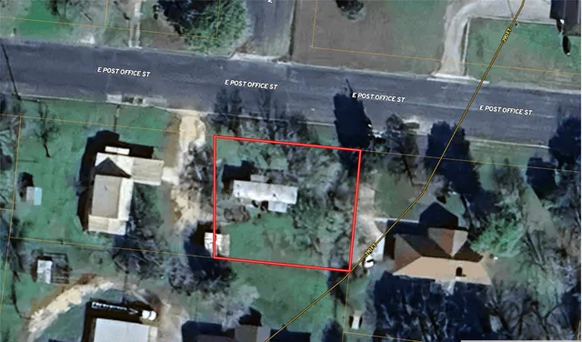 an aerial view of houses with outdoor space