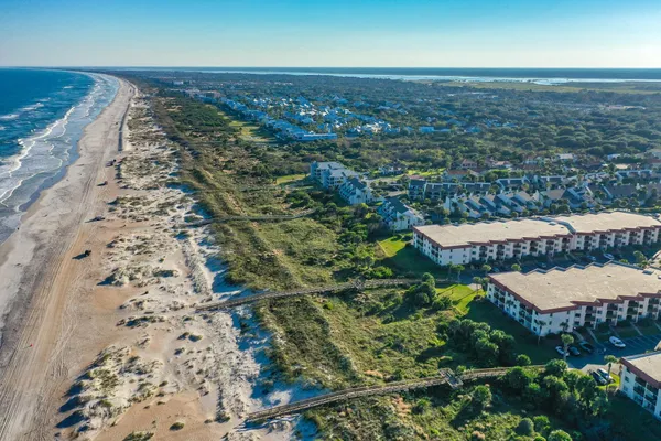 an aerial view of residential houses with outdoor space