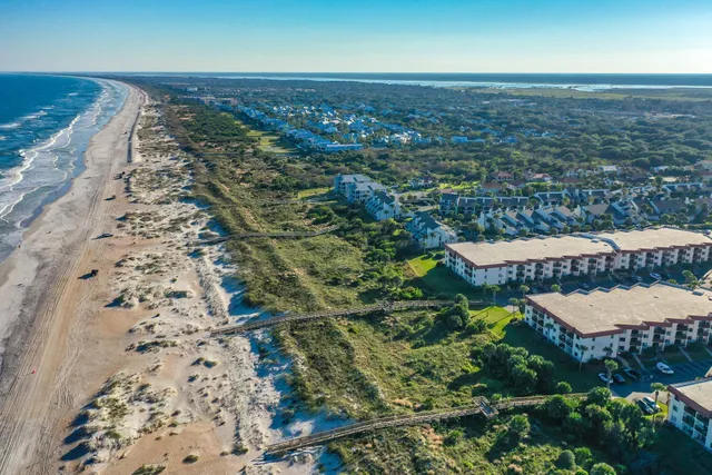 an aerial view of residential houses with outdoor space