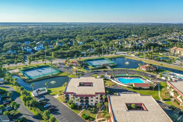 an aerial view of a houses with a lake view