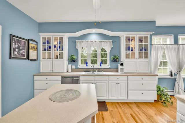a kitchen with a cabinets and chandelier