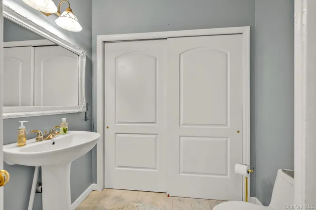 a bathroom with a sink and vanity