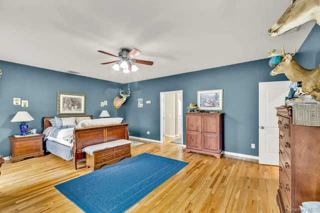a bedroom with furniture and a chandelier