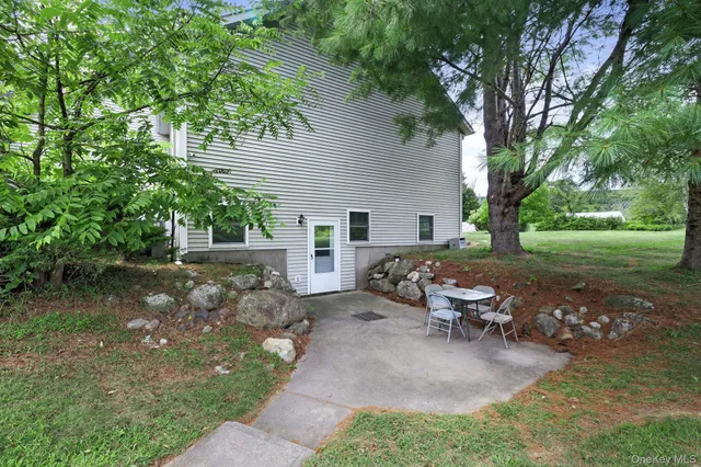 a view of a backyard with sitting area