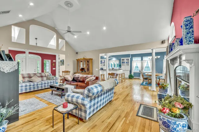 a living room with furniture fireplace and a table