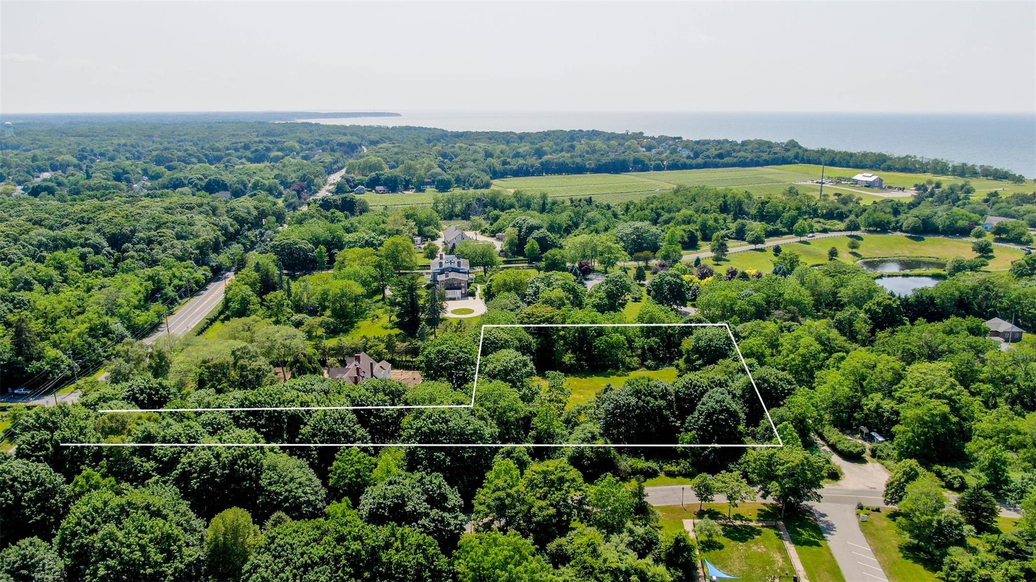 2365 Main Road Greenport, NY 11944 - Photo 3 of 4 an aerial view of a house with a yard