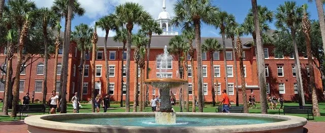 a kitchen with wooden cabinets and a refrigerator