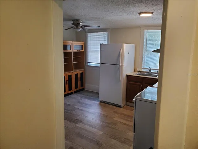 a living room with furniture a rug and a window