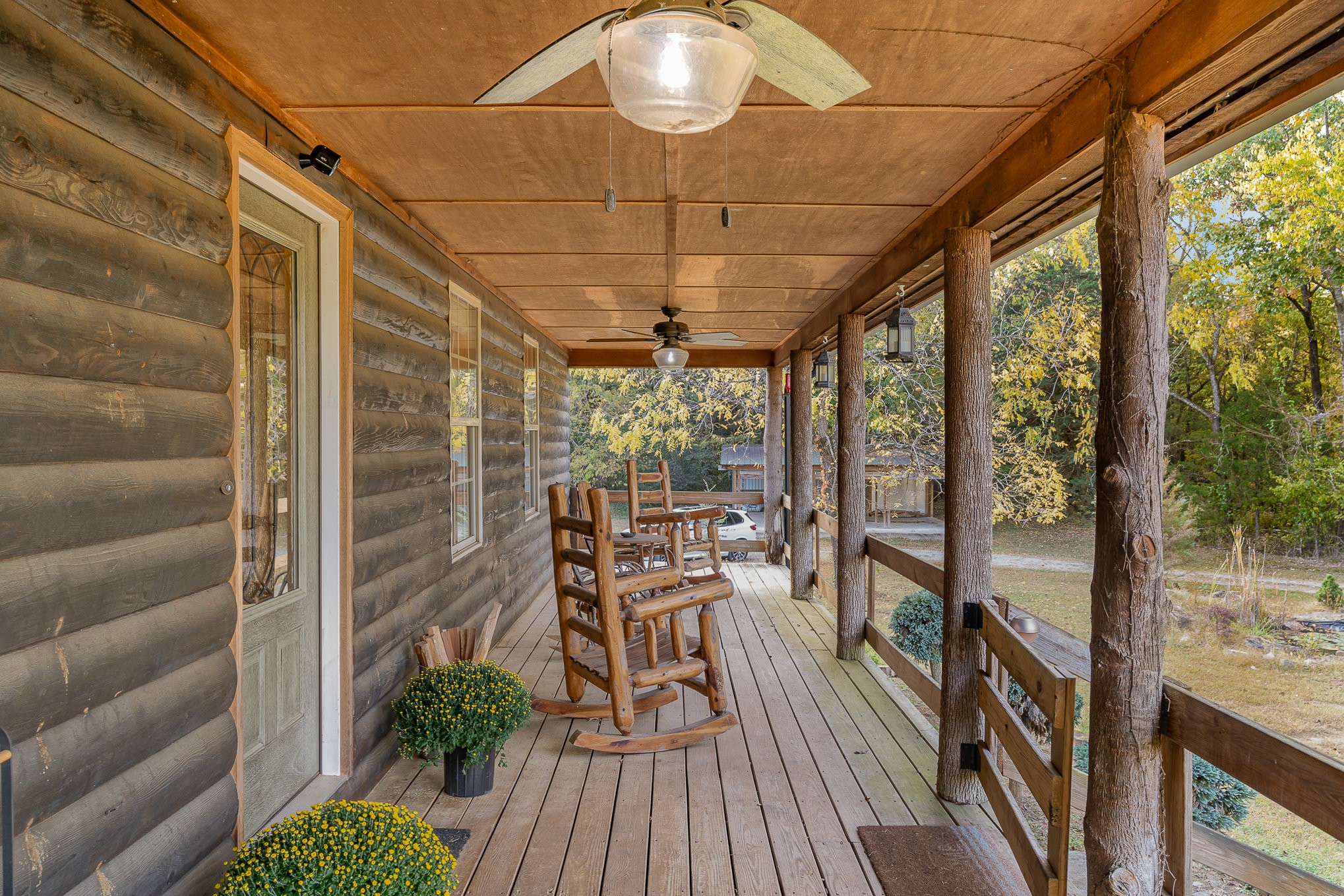 a view of a chairs and table in the balcony