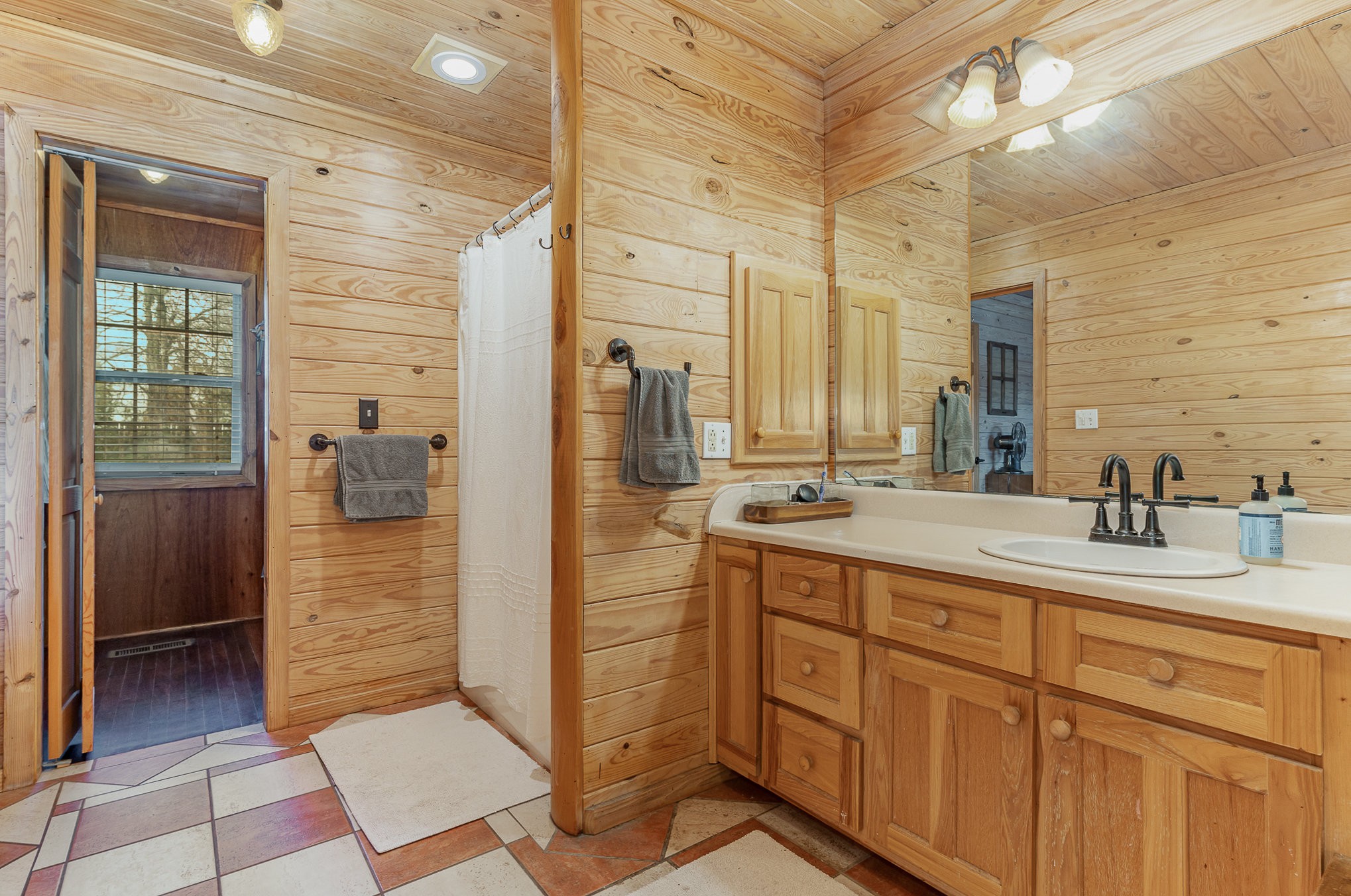 2065 Patterson Cemetery Road Chapel Hill, TN 37034 - Photo 21 of 39 a bathroom with a shower sink and mirror
