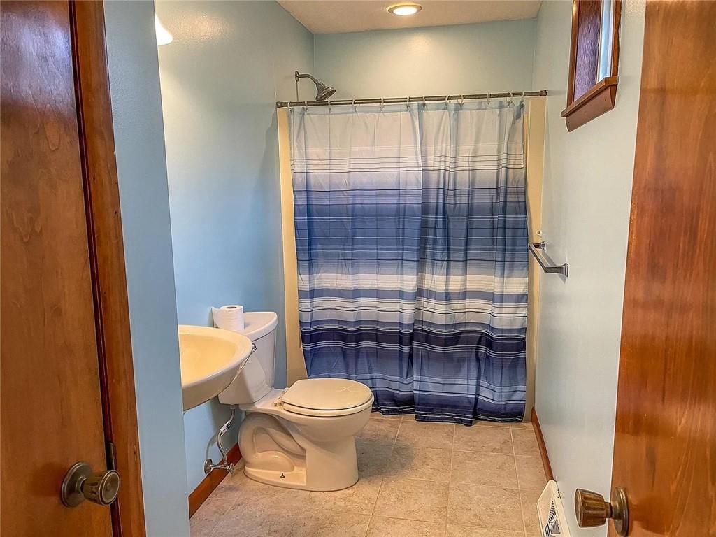 108 Whitney Drive Cranberry Township, PA 16066 - Photo 11 of 22 a bathroom with a toilet and a shower