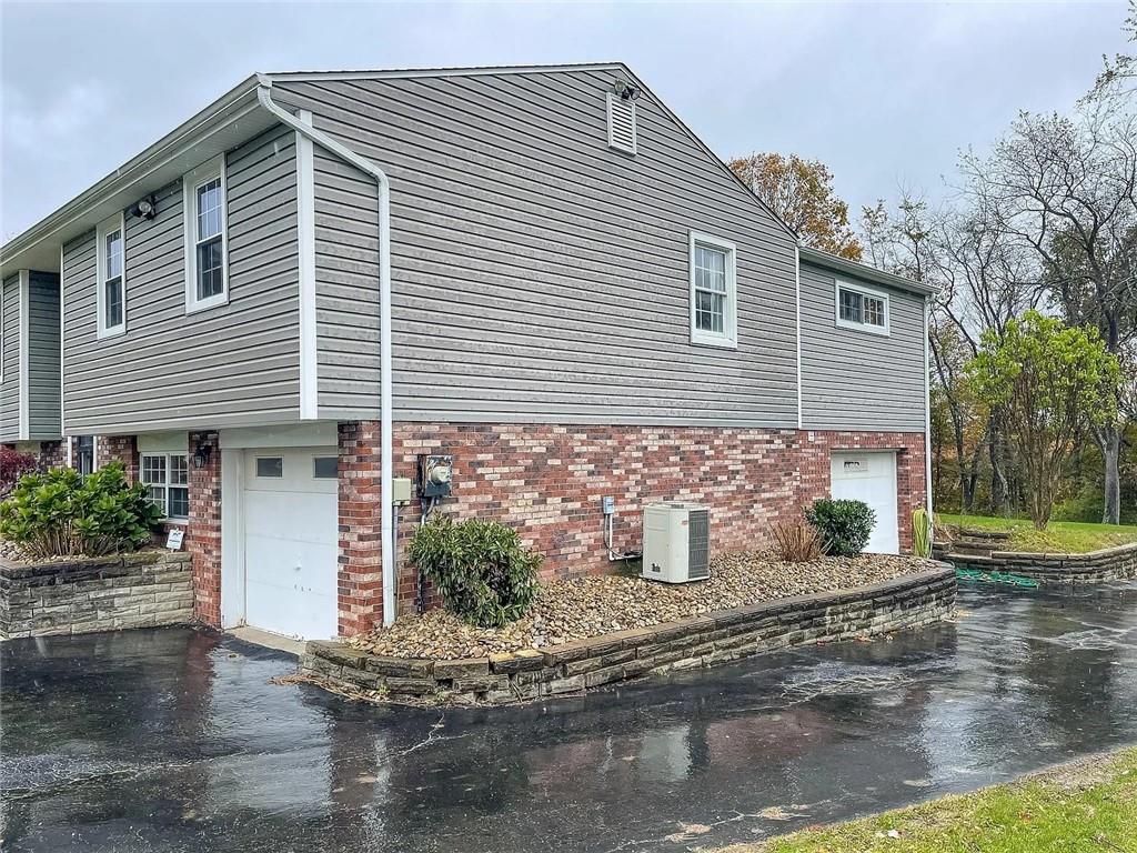 108 Whitney Drive Cranberry Township, PA 16066 - Photo 19 of 22 a front view of a house with garden