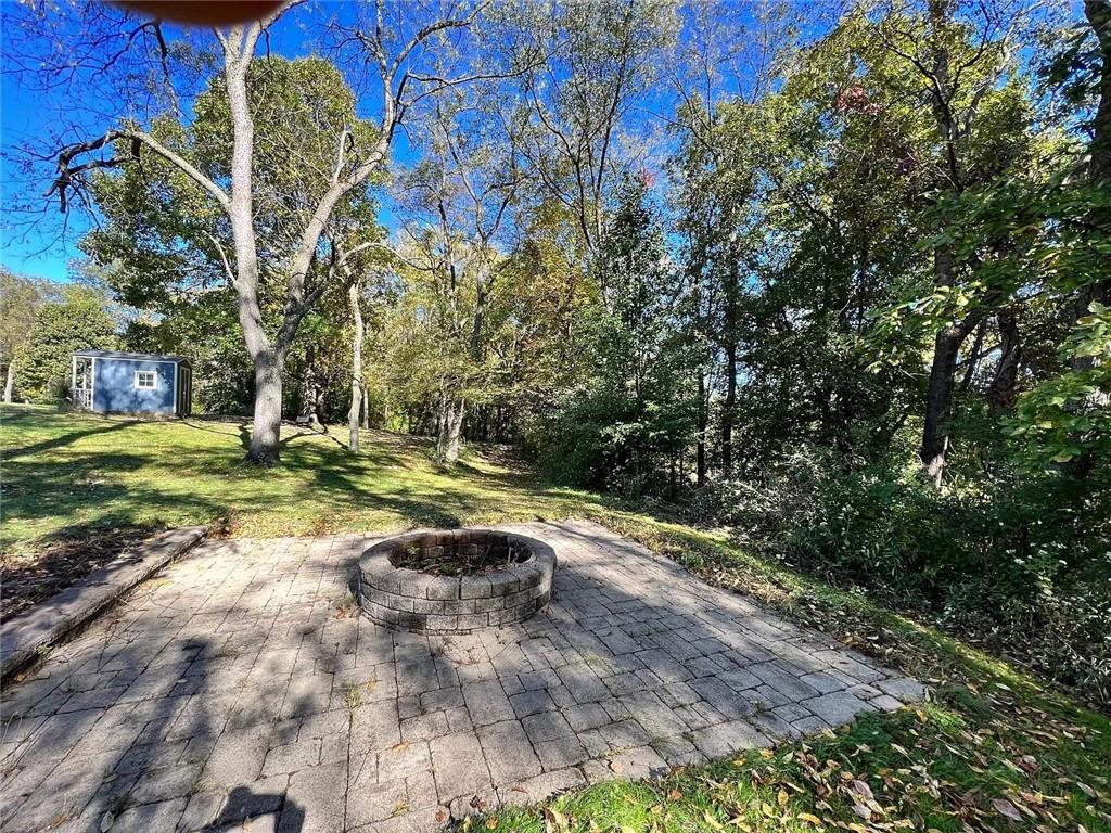 108 Whitney Drive Cranberry Township, PA 16066 - Photo 20 of 22 a view of a backyard with large trees
