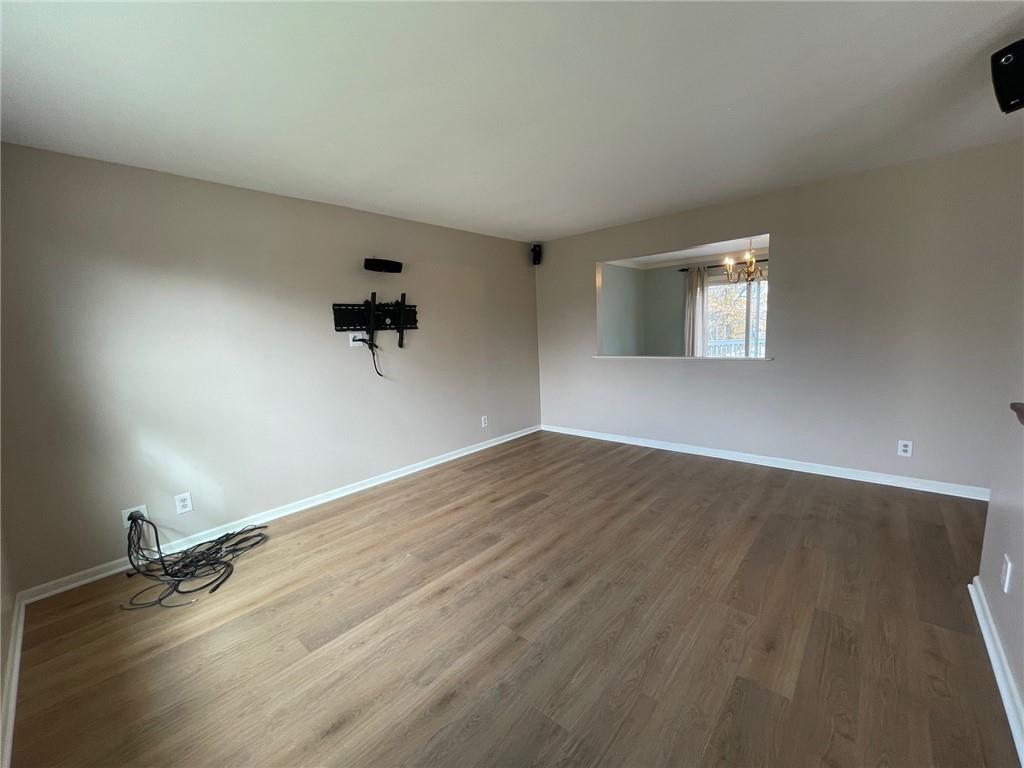 108 Whitney Drive Cranberry Township, PA 16066 - Photo 5 of 22 wooden floor in an empty room with a window