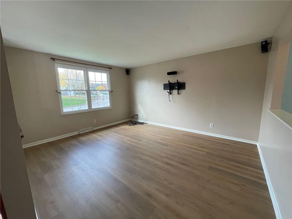 108 Whitney Drive Cranberry Township, PA 16066 - Photo 6 of 22 an empty room with wooden floor and windows