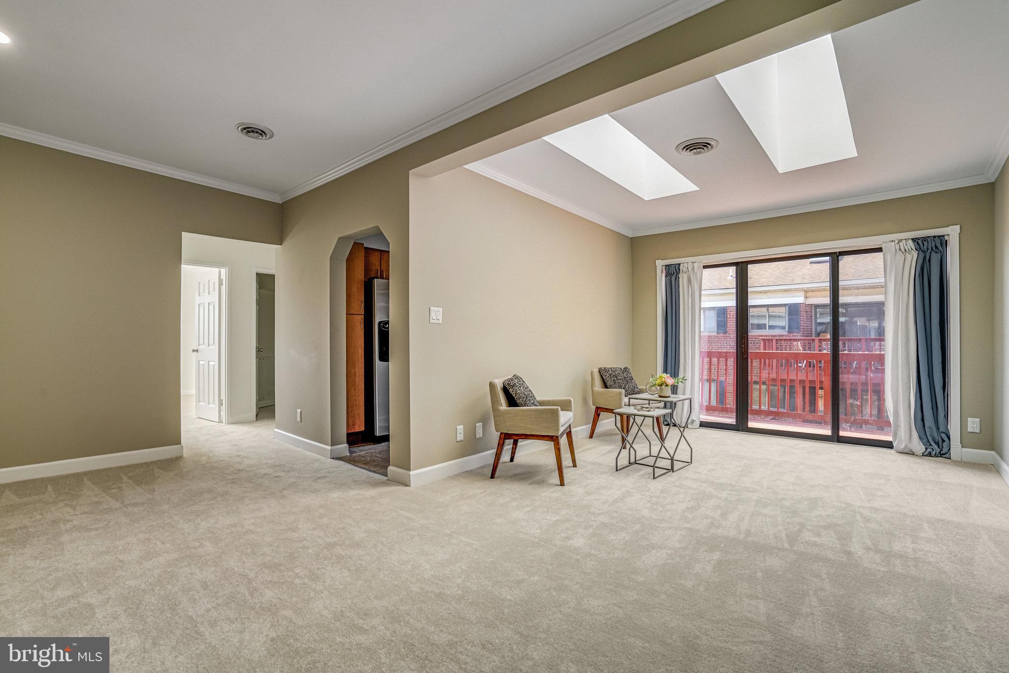 208 Skyhill Road, Unit 10 Alexandria, VA 22314 - Photo 2 of 26 a view of a livingroom with furniture and a large window