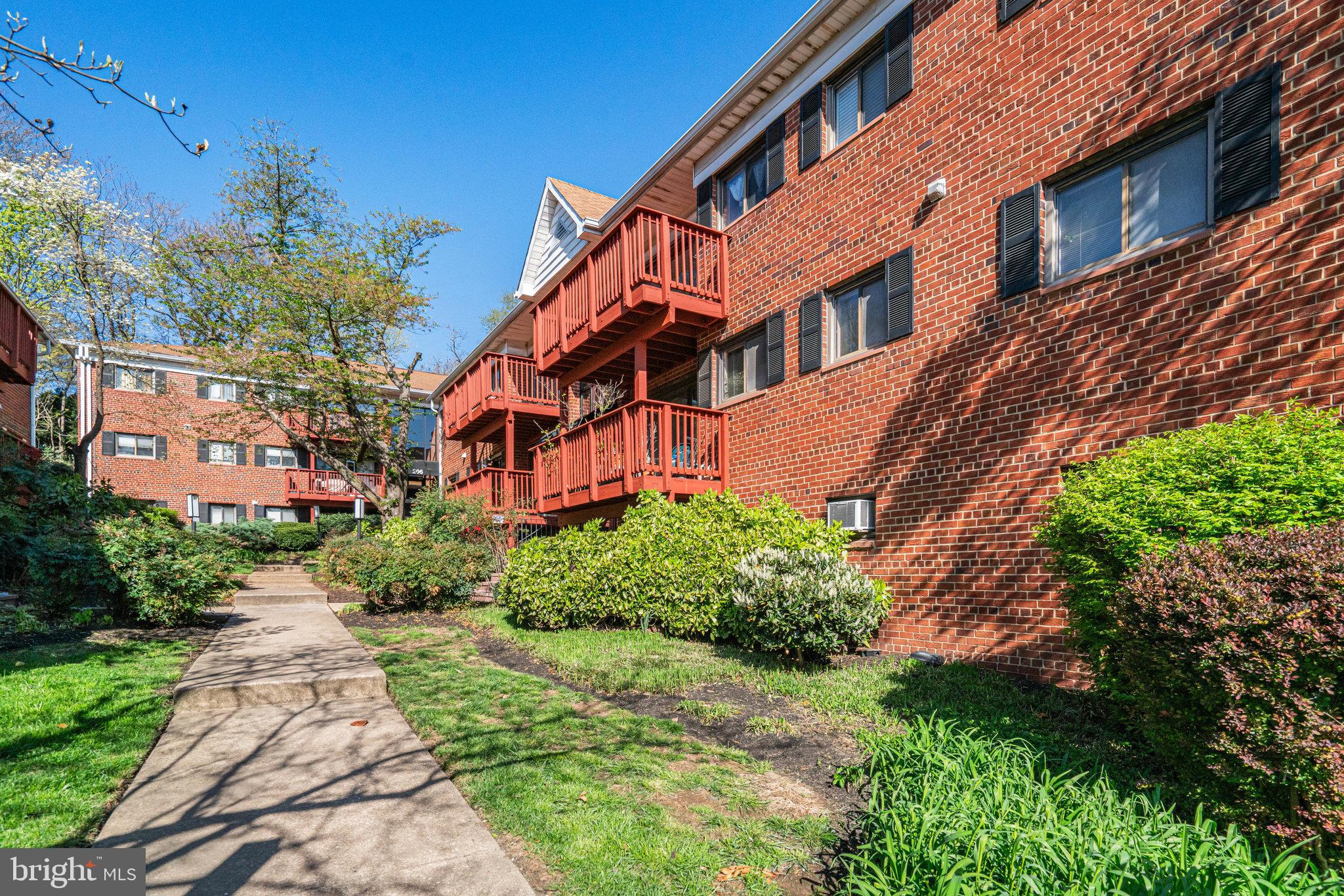 208 Skyhill Road, Unit 10 Alexandria, VA 22314 - Photo 22 of 26 a view of a building with a garden