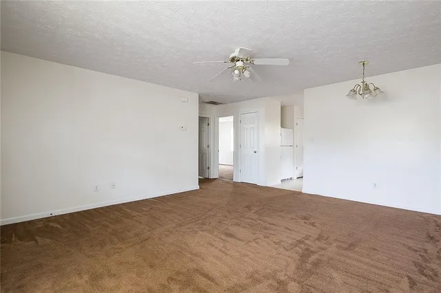 a view of empty room with fan