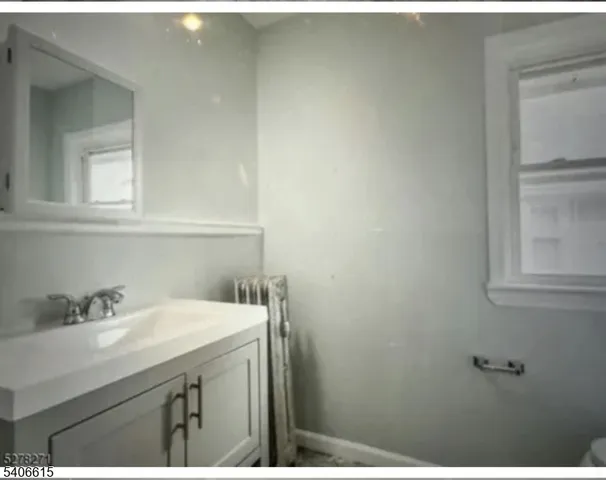 a bathroom with a sink and a vanity
