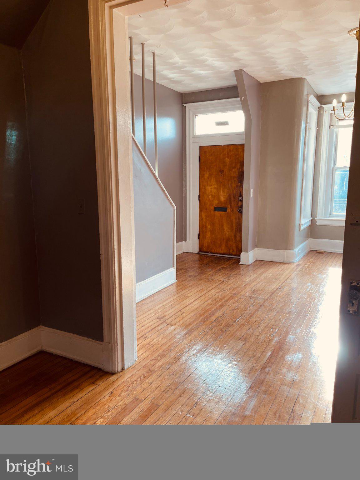 1841 North Capitol Street Northeast Washington, DC 20002 - Photo 5 of 6 Inviting entryway with warm wood floors.
