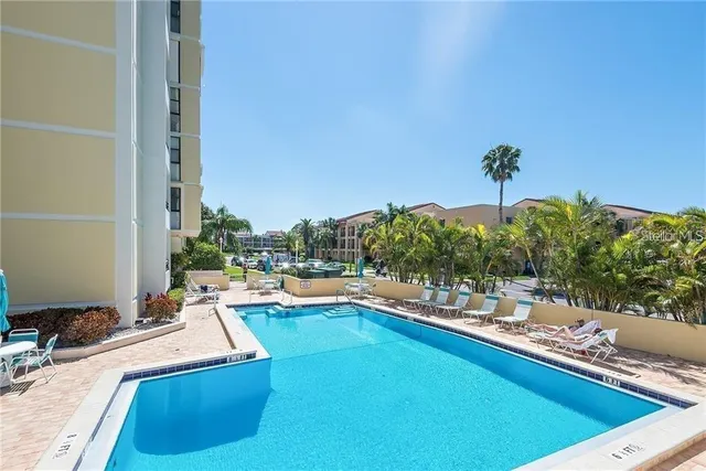 a view of a swimming pool with a patio