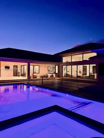a view of swimming pool with chairs