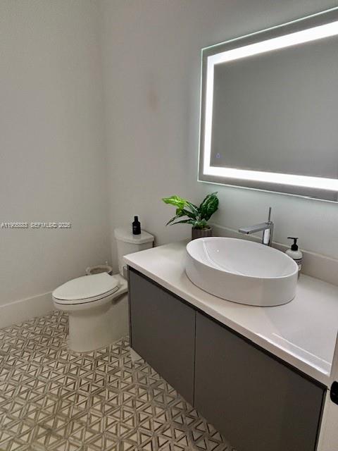 7830 Southwest 117th Street Pinecrest, FL 33156 - Photo 20 of 26 a bathroom with a sink and a toilet
