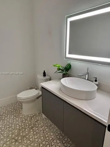 a bathroom with a sink and a toilet