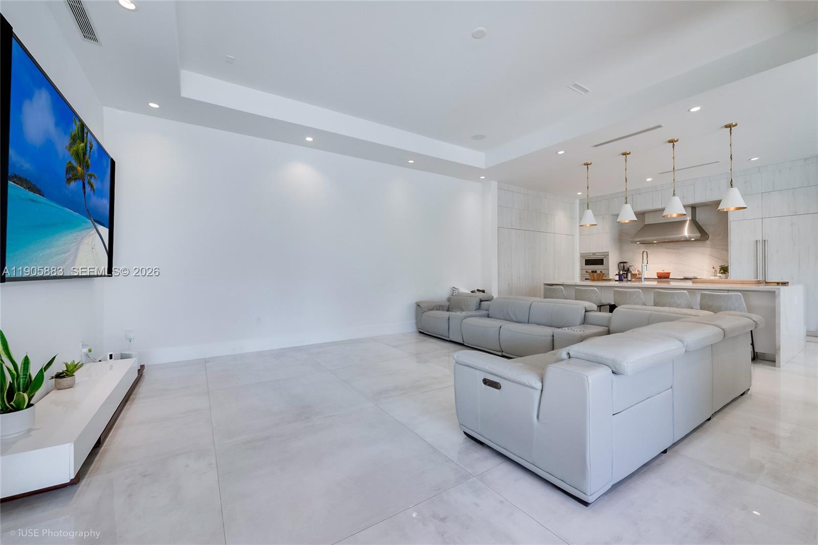 7830 Southwest 117th Street Pinecrest, FL 33156 - Photo 6 of 26 a living room with furniture and kitchen view