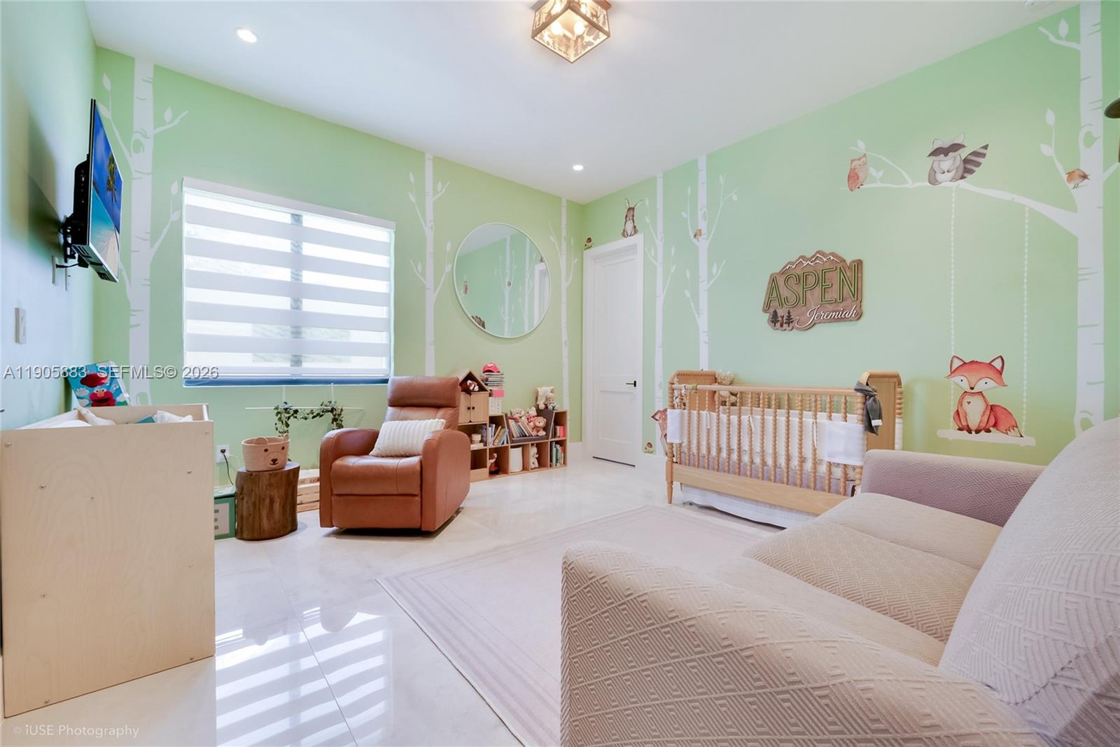 7830 Southwest 117th Street Pinecrest, FL 33156 - Photo 10 of 26 a bedroom with furniture and a window