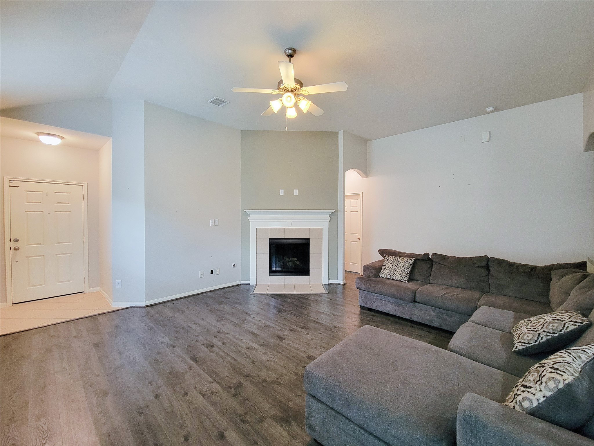 25223 Hazel Ranch Drive Katy, TX 77494 - Photo 6 of 20 a living room with furniture and a fireplace