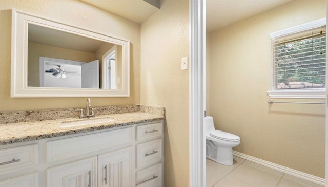 2715 Toyah Avenue Houston, TX 77039 - Photo 11 of 18 This bright and inviting bathroom features elegant granite countertops, ample storage with sleek cabinetry, and a large window for natural light. Perfect for a refreshing start to your day.